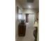 Hallway featuring carpet flooring, wood furniture, and decorative accents that lead to other rooms at 6596 Secluded Ave, Las Vegas, NV 89110