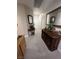 Hallway with carpet flooring featuring wood furniture and mirrors, adding a stylish touch at 6596 Secluded Ave, Las Vegas, NV 89110