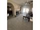 Open-concept living room features a fireplace, tile floors, and sliding glass doors at 6596 Secluded Ave, Las Vegas, NV 89110