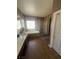 Bathroom featuring a tub, glass-enclosed shower, and tile flooring, perfect for relaxation and comfort at 6596 Secluded Ave, Las Vegas, NV 89110