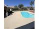 This backyard features a pristine pool surrounded by well-maintained landscaping and offers a serene retreat at 6596 Secluded Ave, Las Vegas, NV 89110