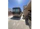 A recreational vehicle is parked in the driveway of a single-story home at 6596 Secluded Ave, Las Vegas, NV 89110