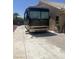 RV parked in a paved driveway next to a single-story home at 6596 Secluded Ave, Las Vegas, NV 89110