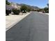 A view of the neighborhood street with mountain views in the distance at 6596 Secluded Ave, Las Vegas, NV 89110