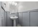 Half bathroom featuring a pedestal sink and wainscoting at 6626 Evander St, North Las Vegas, NV 89086