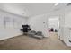 Upstairs bedroom has neutral carpet with an office area and sitting area at 6626 Evander St, North Las Vegas, NV 89086