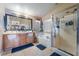 Bright bathroom with a double sink vanity, soaking tub, and a glass enclosed shower stall at 6715 Maple Mesa St, North Las Vegas, NV 89084