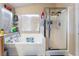 Bright bathroom features a tiled soaking tub and shower with glass doors for a clean, modern look at 6715 Maple Mesa St, North Las Vegas, NV 89084