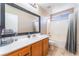 Bright bathroom with a white countertop vanity and a tub and shower combo at 6715 Maple Mesa St, North Las Vegas, NV 89084