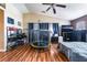 A large bedroom with hardwood floors, a trampoline, and neutral walls at 6715 Maple Mesa St, North Las Vegas, NV 89084
