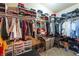 Walk-in closet with custom shelving and ample storage space, perfect for organizing clothes and accessories at 6715 Maple Mesa St, North Las Vegas, NV 89084
