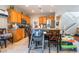 View of a kitchen with stainless steel appliances, tile floors, and wooden cabinets at 6715 Maple Mesa St, North Las Vegas, NV 89084