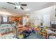 Open-concept living area with hardwood floors, stairs leading to the second floor, and ample natural light at 6715 Maple Mesa St, North Las Vegas, NV 89084
