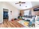 Spacious living room with wood flooring and ceiling fan in home at 6715 Maple Mesa St, North Las Vegas, NV 89084