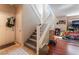 Carpeted staircase and wood flooring in entry to home with natural light at 6715 Maple Mesa St, North Las Vegas, NV 89084