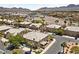 Stunning aerial view of a well-maintained community, showcasing the beautiful homes and desert landscape at 675 Harbor Mist Ave, Henderson, NV 89015