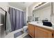 Neutral bathroom featuring a shower, a single sink and a toilet at 675 Harbor Mist Ave, Henderson, NV 89015