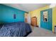 Bright, colorful bedroom, features soft carpet, and stylish furnishings, perfect for rest and relaxation at 675 Harbor Mist Ave, Henderson, NV 89015