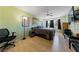 Relaxing primary bedroom with ceiling fan and light colored wood flooring at 675 Harbor Mist Ave, Henderson, NV 89015