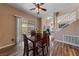 Bright dining area featuring hardwood floors, modern lighting, and a sliding door to the backyard at 675 Harbor Mist Ave, Henderson, NV 89015
