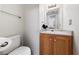 Nice half bath with a single sink and light fixtures at 675 Harbor Mist Ave, Henderson, NV 89015