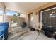 Patio with a covered roof, providing shade and a comfortable outdoor space with secure gate at 675 Harbor Mist Ave, Henderson, NV 89015