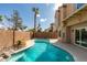 Inviting backyard pool with privacy wall and a view of the house at 71 Sea Holly Way, Henderson, NV 89074