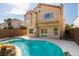 Private backyard pool with tropical landscaping perfect for outdoor living and entertaining at 71 Sea Holly Way, Henderson, NV 89074