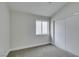 Bedroom featuring carpet flooring, a window, and a sliding closet at 71 Sea Holly Way, Henderson, NV 89074