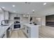 Modern kitchen featuring stainless steel appliances, an island, and sleek cabinets at 71 Sea Holly Way, Henderson, NV 89074
