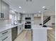 Updated kitchen featuring a center island, stainless steel appliances, and bright lighting at 71 Sea Holly Way, Henderson, NV 89074