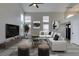 Living room featuring neutral colors, modern furniture, and high ceilings at 71 Sea Holly Way, Henderson, NV 89074