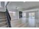 Modern living room with fireplace, pool view, and access to the backyard through sliding doors at 71 Sea Holly Way, Henderson, NV 89074