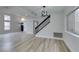 Living room featuring staircase, high ceilings and abundant natural light at 71 Sea Holly Way, Henderson, NV 89074