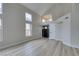 Bright and airy living room with high ceilings and large windows and tile floors at 71 Sea Holly Way, Henderson, NV 89074