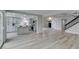 Open-concept living area with adjacent kitchen, modern finishes, and seamless flow for entertaining and relaxation at 71 Sea Holly Way, Henderson, NV 89074