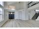 Spacious living room with high ceilings, modern floors, and decorative front door at 71 Sea Holly Way, Henderson, NV 89074