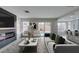 Inviting living room with a fireplace, a view of the pool and a sliding door at 71 Sea Holly Way, Henderson, NV 89074
