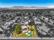 A beautiful aerial shot showcases a home with solar panels and pool in a desert neighborhood at 7300 Breezy Night Ct, Las Vegas, NV 89129