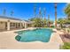 Relaxing backyard pool with multiple access points, providing the perfect space for outdoor enjoyment and recreation at 7300 Breezy Night Ct, Las Vegas, NV 89129