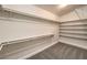 Walk-in closet with built-in shelving and rods, offering ample storage space for an organized wardrobe at 7300 Breezy Night Ct, Las Vegas, NV 89129