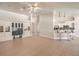 Open living area with a built-in entertainment center and seamless flow into the kitchen and dining areas at 7300 Breezy Night Ct, Las Vegas, NV 89129