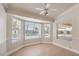 Bright sitting room with large windows offering backyard and pool views, creating a serene space at 7300 Breezy Night Ct, Las Vegas, NV 89129