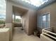 Balcony space featuring stucco walls, tile roofing, and mountain views at 75 N Valle Verde Dr # 625, Henderson, NV 89074