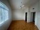 This bedroom has laminate flooring, a ceiling fan, and a window at 75 N Valle Verde Dr # 625, Henderson, NV 89074