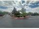 Exterior view of community streets, buildings, and landscaping on a sunny day with blue sky at 75 N Valle Verde Dr # 625, Henderson, NV 89074