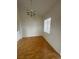 Dining room with vinyl floors, modern chandelier, and a bright window at 75 N Valle Verde Dr # 625, Henderson, NV 89074