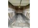 View of the spacious attached garage with painted walls and concrete floor at 75 N Valle Verde Dr # 625, Henderson, NV 89074