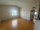 Bright living room with hardwood floors, vaulted ceilings, and large windows with neighborhood views at 75 N Valle Verde Dr # 625, Henderson, NV 89074