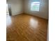 Inviting living room with vinyl floors and a bright window at 75 N Valle Verde Dr # 625, Henderson, NV 89074
